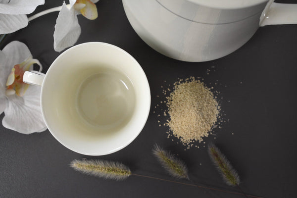 A cup and some herbs, typically mixed into hot water and consumed as tea two or three times per day